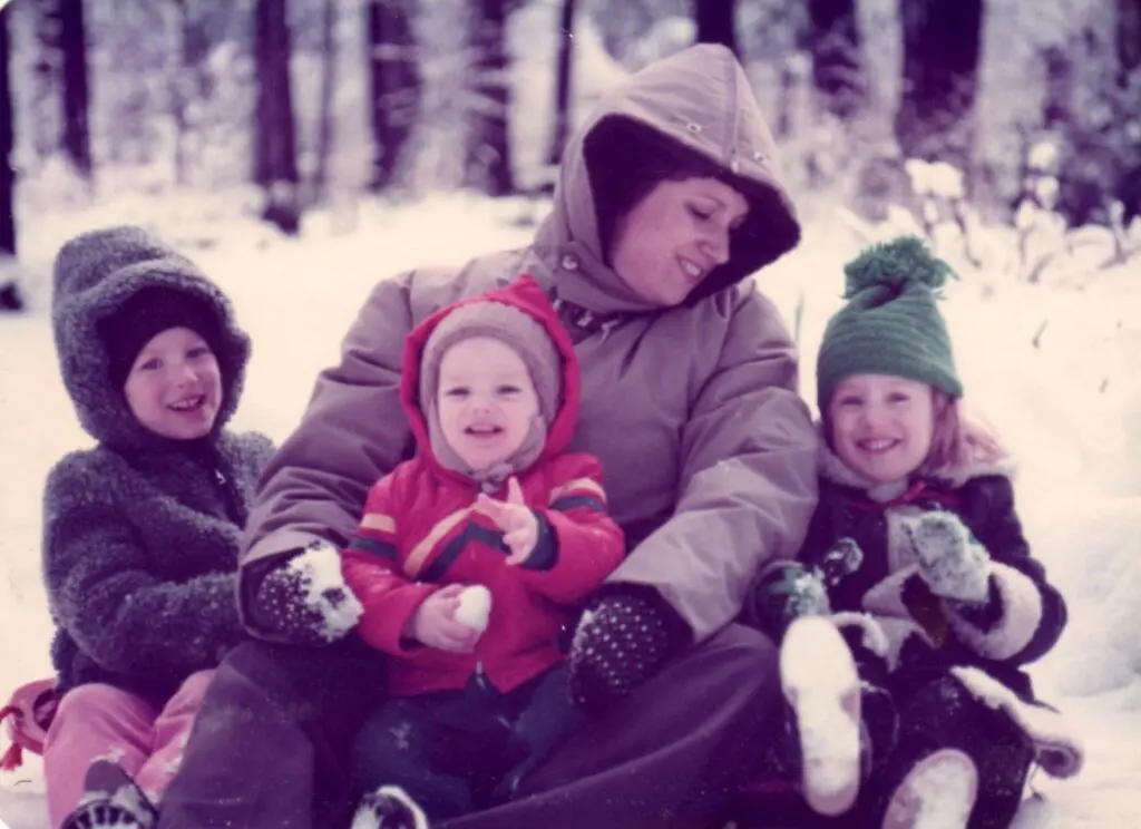 Family enjoying a snowy day together.